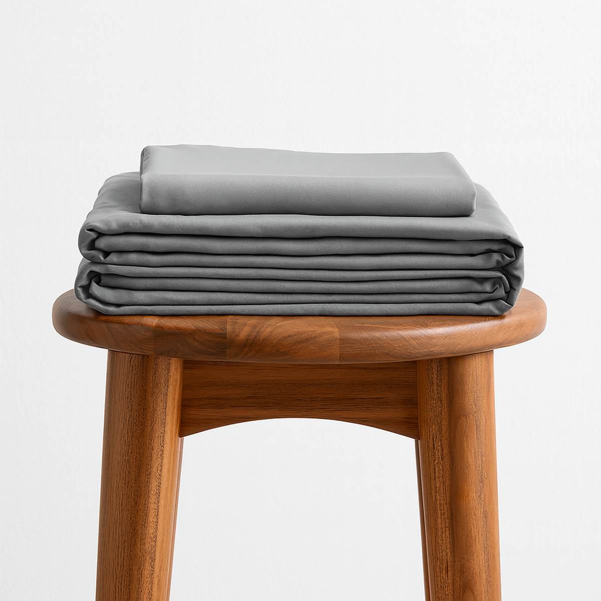 Bedly Bamboo Bed Set made up on a Twin XL dorm bed with fitted sheet, flat sheet, and pillowcase